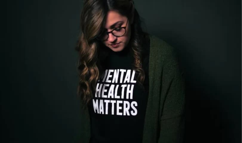 Person wearing a mental health awareness T-shirt