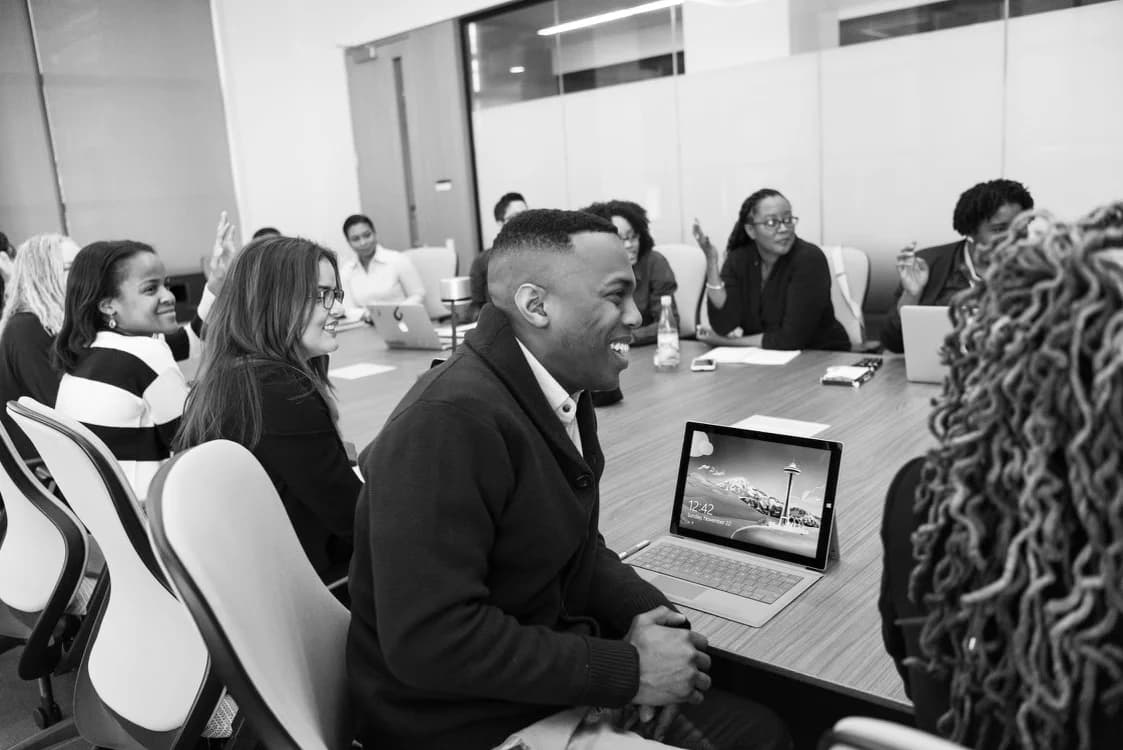 Andrew Fuller taking part in a group discussion around a table